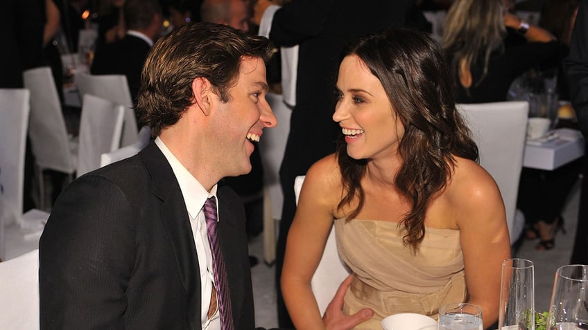 John Krasinski and Emily Blunt laughing together