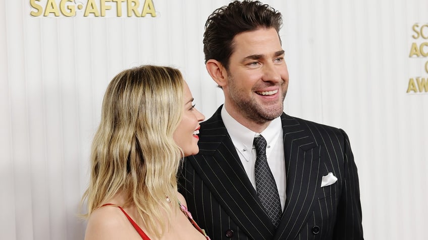 Emily Blunt smiling at John Krasinski