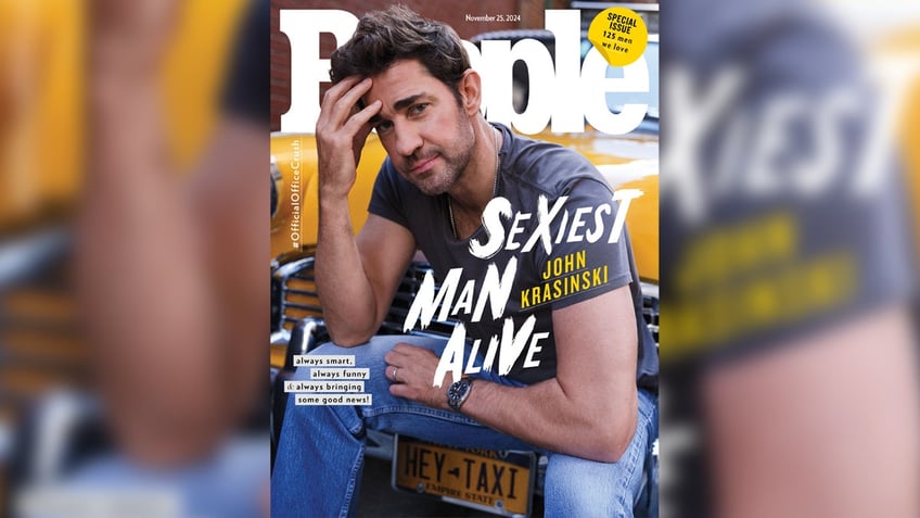 John Krasinski poses in a T-shirt and jeans for Sexiest Man Alive cover