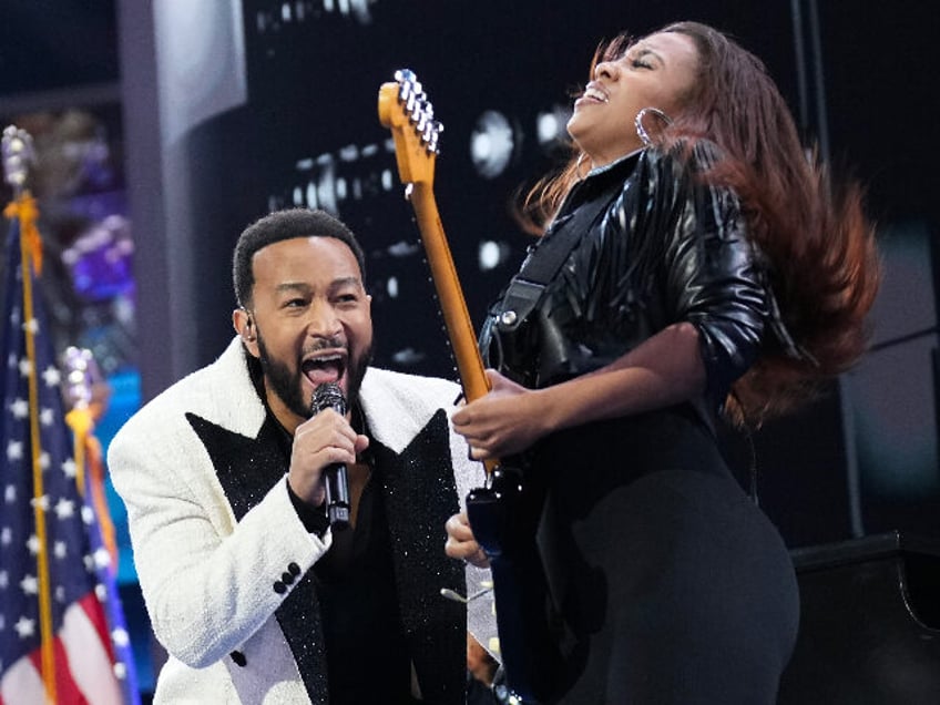 CHICAGO, ILLINOIS - AUGUST 21: Musician John Legend performs on stage during the third day