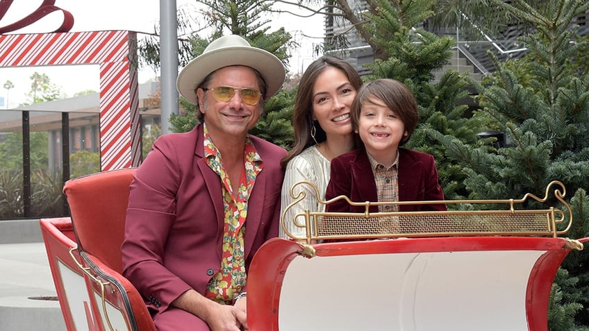 John Stamos with Caitlin and their son