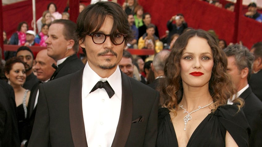Vanessa Paradis and Johnny Depp posting together on the red carpet.