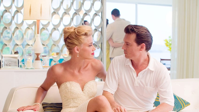 Johnny Depp and Amber Heard acting out a scene in The Rum Diary.