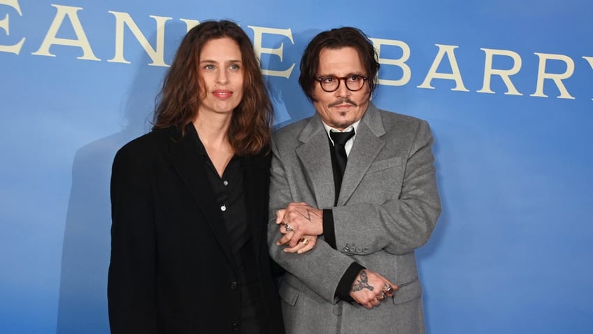 maiwenn and johnny depp at jeanne du barry red carpet