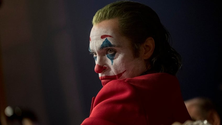 This image released by Warner Bros. Pictures shows Joaquin Phoenix in a scene from "Joker," in theaters on Oct. 4. The Army is warning soldiers about the potential for violence at screenings of the film. (Niko Tavernise/Warner Bros. Pictures via AP)