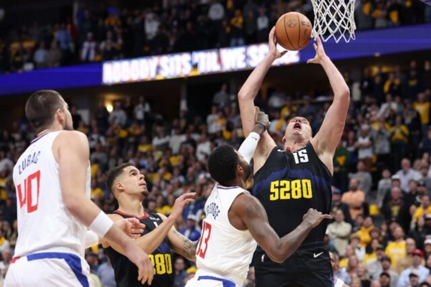 jokic leads nuggets past clippers warriors and wolves brawl