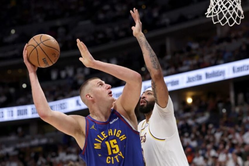 Denver star Nikola Jokic puts up a shot over Anthony Davis in the Nuggets' victory over th