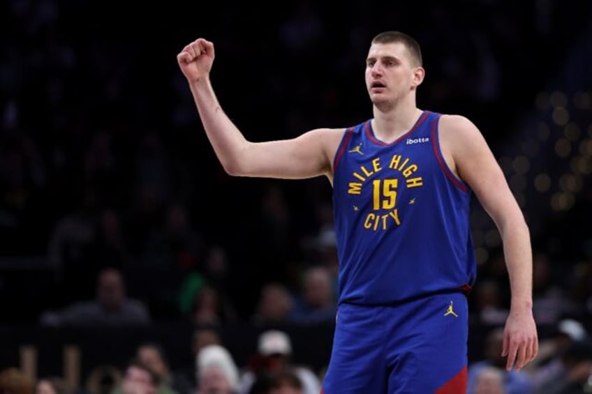 Two-time NBA Most Valuable Player Nikola Jokic of the Denver Nuggets celebrates during the second half of an NBA victory over Washington