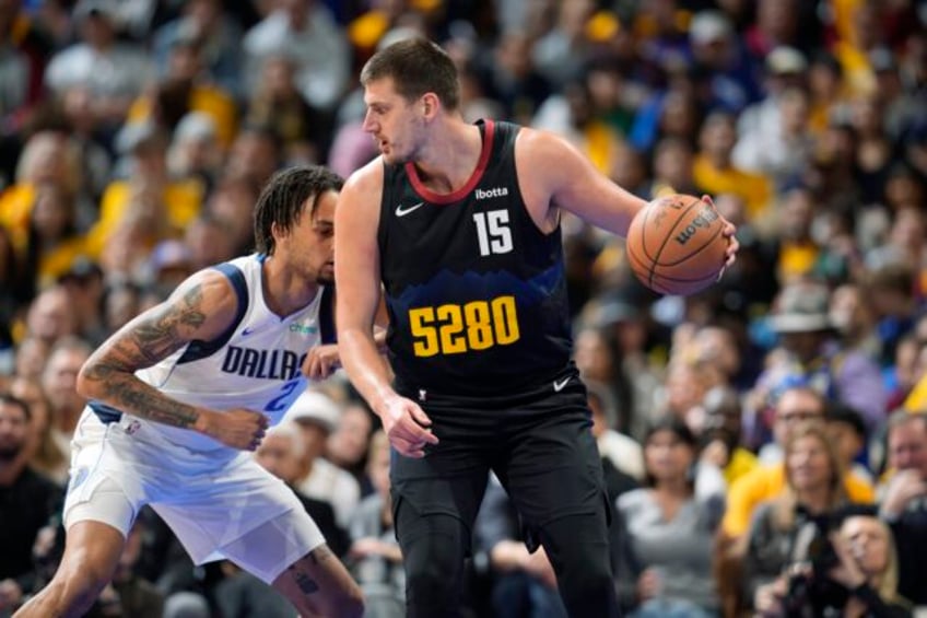 jokic scores 33 points leads nuggets to 125 114 win over mavericks in nba tournament opener