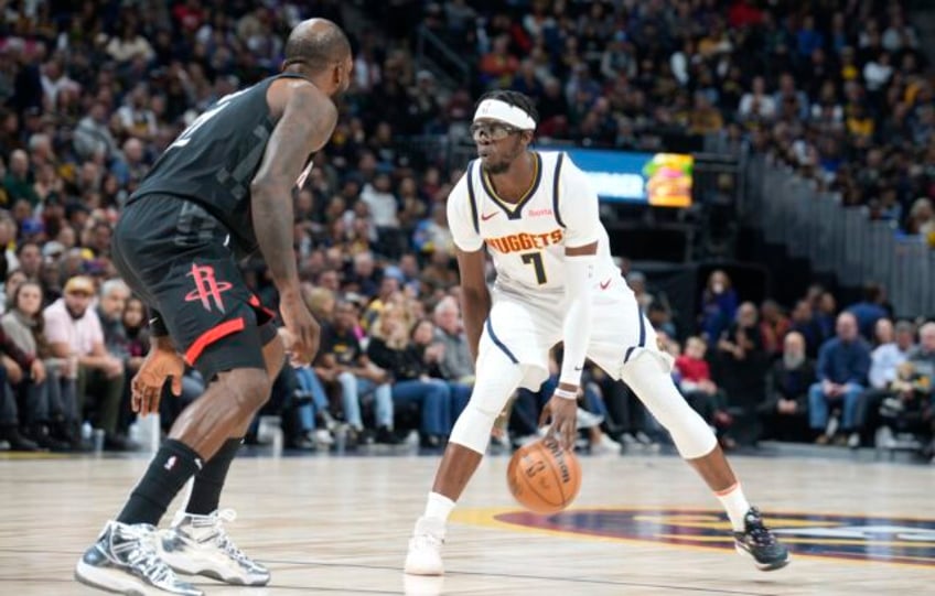 jokics triple double lifts nuggets past rockets 134 124 in murrays return