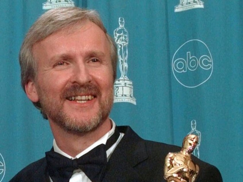 FILE - James Cameron, right, and Jon Landau hold the Oscars for Best Picture for the film