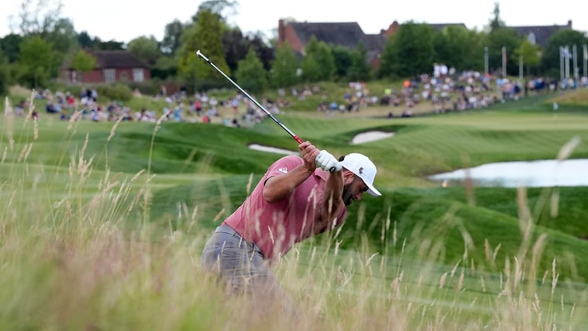 Jon Rahm swings