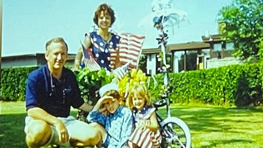 The Ramsey family photographed with American flags