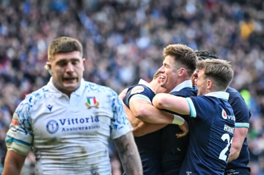 Huw Jones (C) scored a trio of tries to ensure Scotland got off to a winning start in the