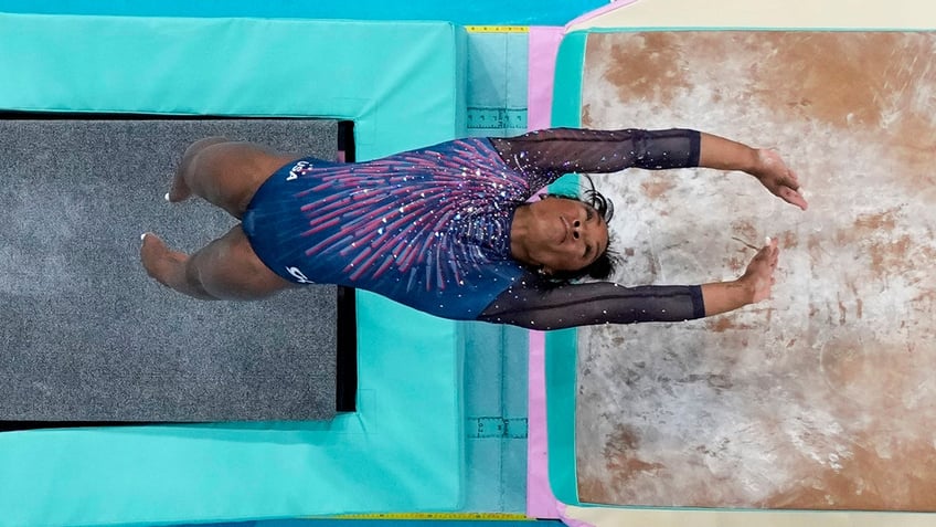 Simone Biles performs a vault