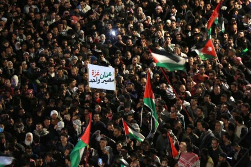 Jordanians rally in support of Gaza near the Israeli embassy in Amman on March 28, 2024