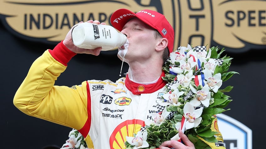 Josef Newgarden drinks milk jug