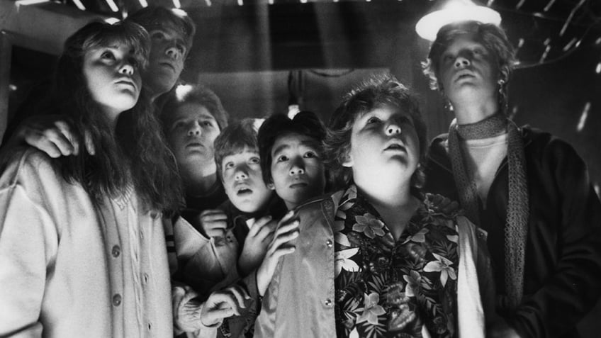 The cast of "The Goonies" filming a scene