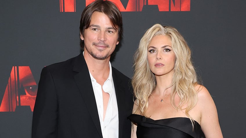 Josh Hartnett smiles alongside wife Tamsin Egerton at Trap premiere.