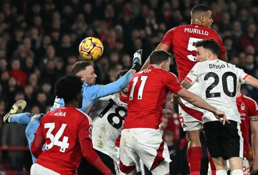 Liverpool's Diogo Jota (R) scores the equaliser at Nottingham Forest