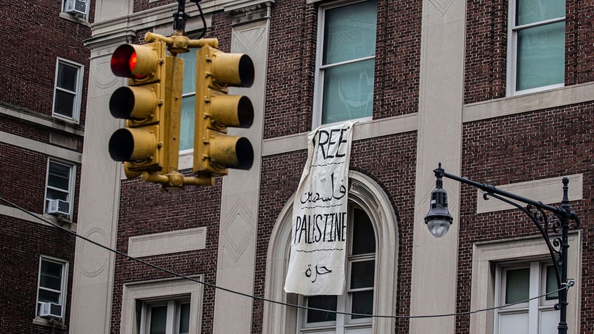 A sign hangs from Hamilton Hall at Columbia University