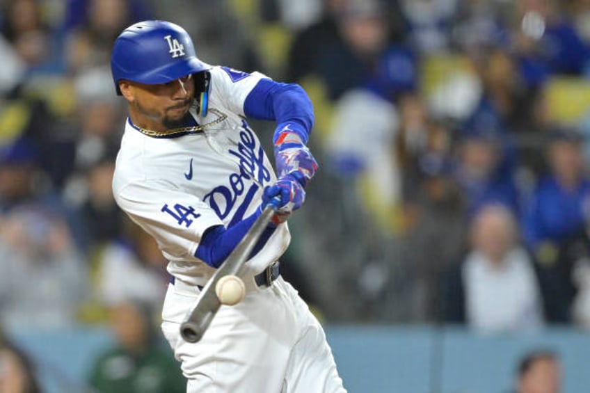 Mookie Betts of the Los Angeles Dodgers doubles in the seventh inning against the Washington Nationals at Dodger Stadium on April 16, 2024 in Los...