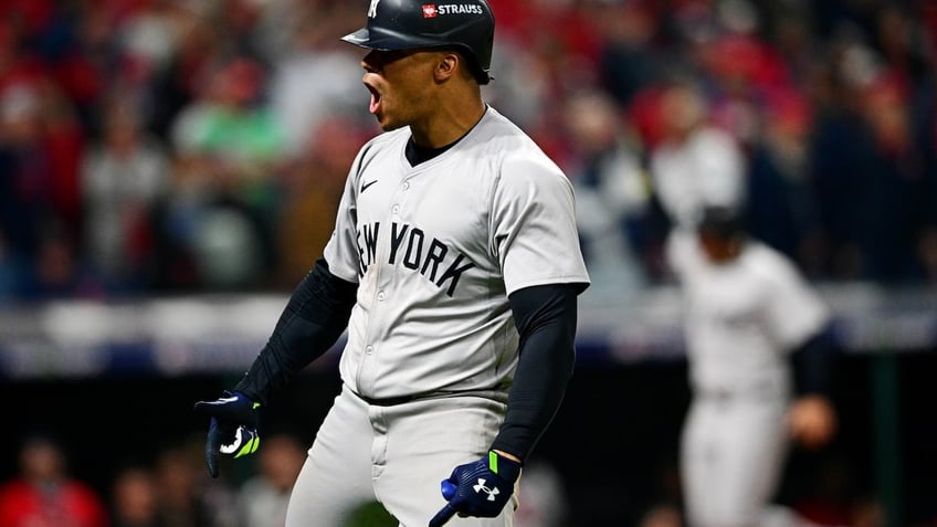 New York Yankees outfielder Juan Soto celebrates after hitting a three run home run during the tenth inning against the Cleveland Guardians during game five of the ALCS for the 2024 MLB playoffs at Progressive Field. 