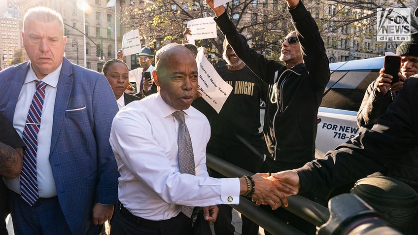 New York City Mayor Eric Adams shakes hands with constituent