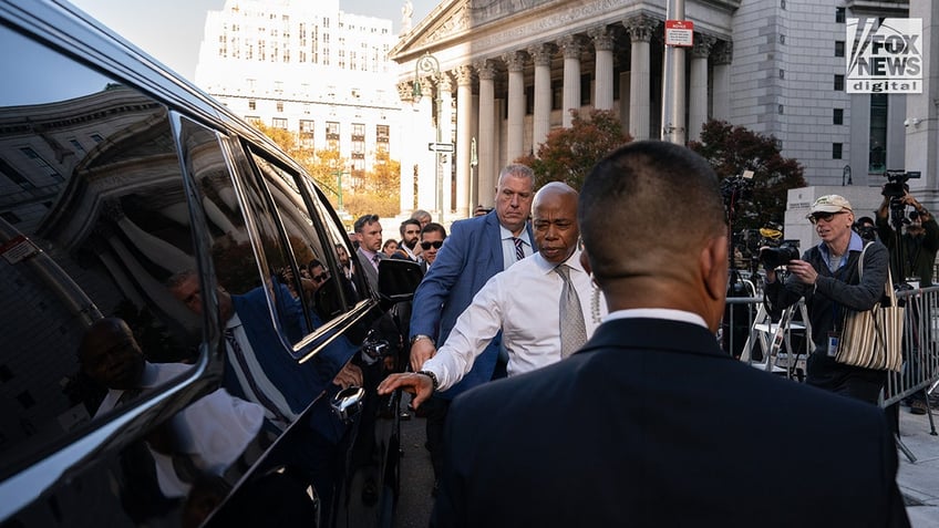 New York City Mayor Eric Adams seen getting into a car outside a courthouse