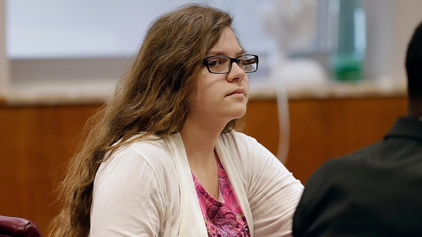 FILE - In this Sept. 13, 2017 file photo, Anissa Weier, listens as former teachers testify during her trial in Waukesha County Court, in Waukesha, Wis. One of the two Wisconsin girls accused of stabbing a classmate, Payton Leuter, in 2014 to gain the favor of a horror character named Slender Man will soon learn how long she will spend in a mental health facility. A judge in Waukesha County Circuit Court on Thursday, Dec. 21, 2017, is expected to send 16-year-old Weier to a facility for at least three years after she was previously found not guilty by reason of mental disease or defect. (Rick Wood/Milwaukee Journal-Sentinel via AP, Pool, File)