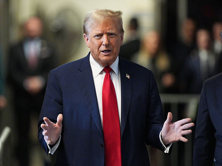 Former US President Donald Trump speaks to the press as he arrives for his trial for alleg