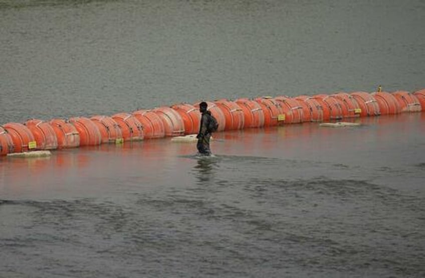 judge orders texas to remove floating border buoys by next friday in win for biden doj