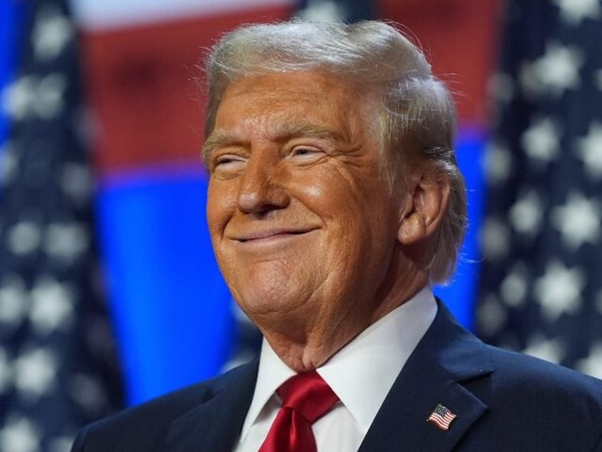 Republican presidential nominee former President Donald Trump smiles at an election night