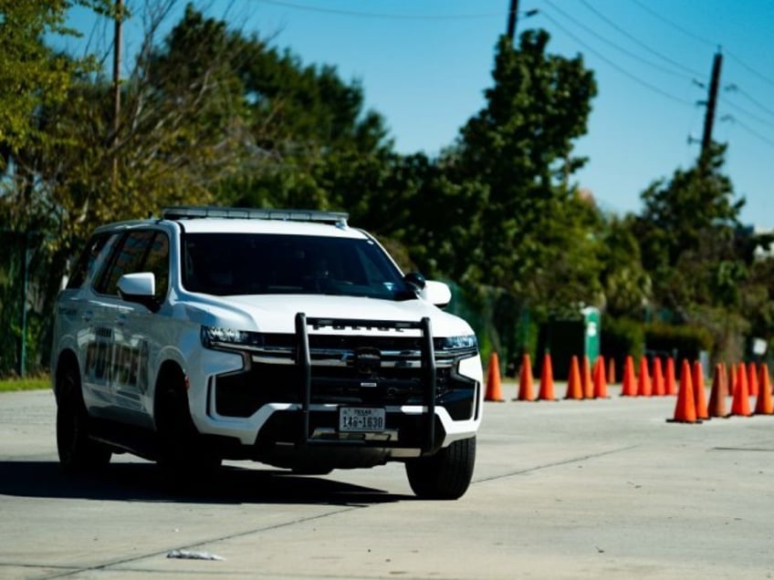 A police car outside of the canceled AstroWorld festival at NRG Park on November 6, 2021 in Houston, Texas. According to authorities, eight people died and 17 people were transported to local hospitals after what they describe as a crowd surge at the Astroworld festival, a music festival started by Houston-native rapper and musician Travis Scott in 2018. (Photo by Alex Bierens de Haan/Getty Images)