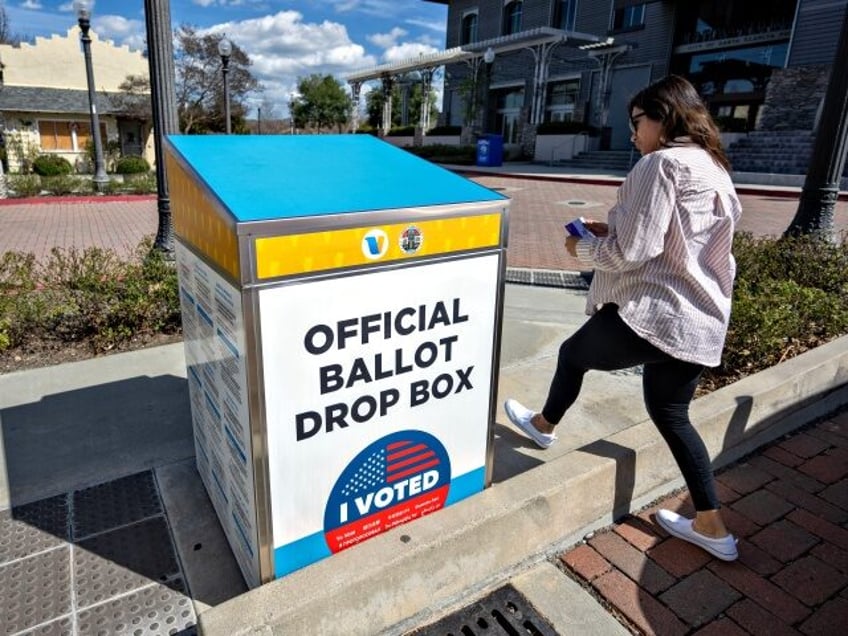 Santa Clarita , CA - March 04: Cindy Martinez drops off her ballot at the Old Town Newhall