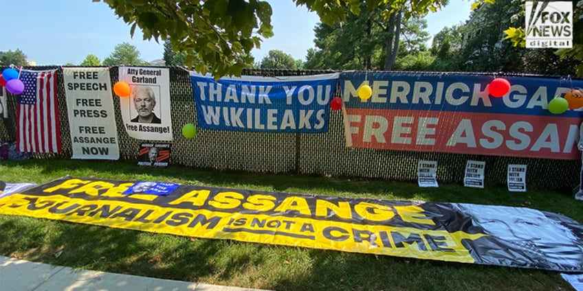 julian assange supporters demand charges be dropped in vigil outside merrick garlands home