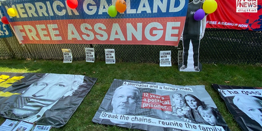 julian assange supporters demand charges be dropped in vigil outside merrick garlands home