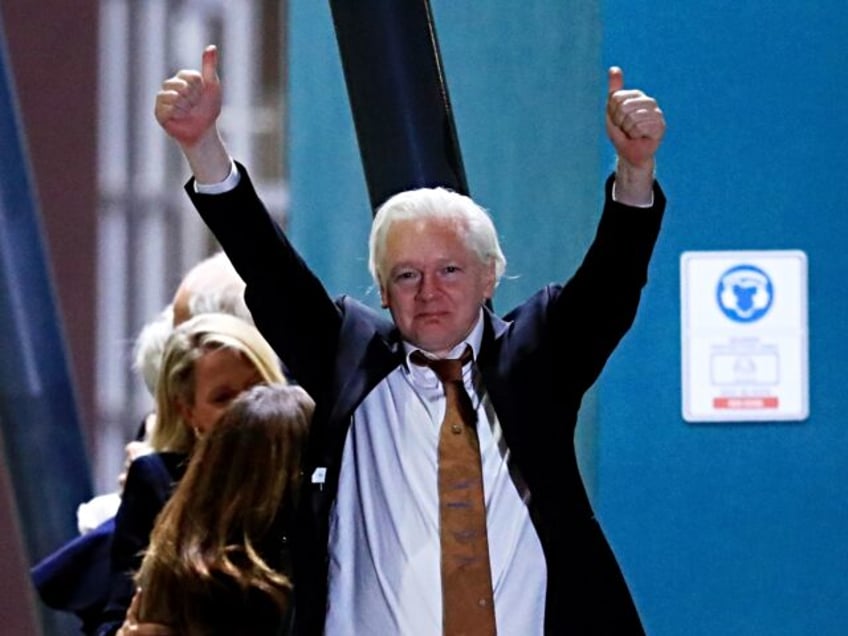 CANBERRA, AUSTRALIA - JUNE 26: WikiLeaks founder Julian Assange gestures as he arrives at