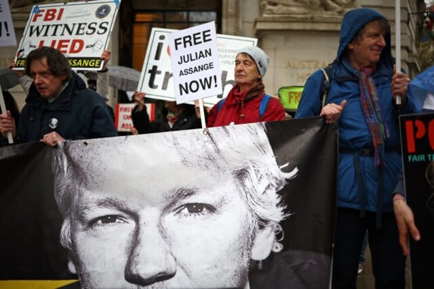 Supporters of WikiLeaks founder Julian Assange protest outside the Australian High Commiss