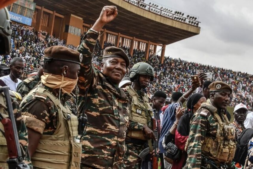 Niger junta chief General Abdourahamane Tiani (2nd L) took power in the Sahelian country i