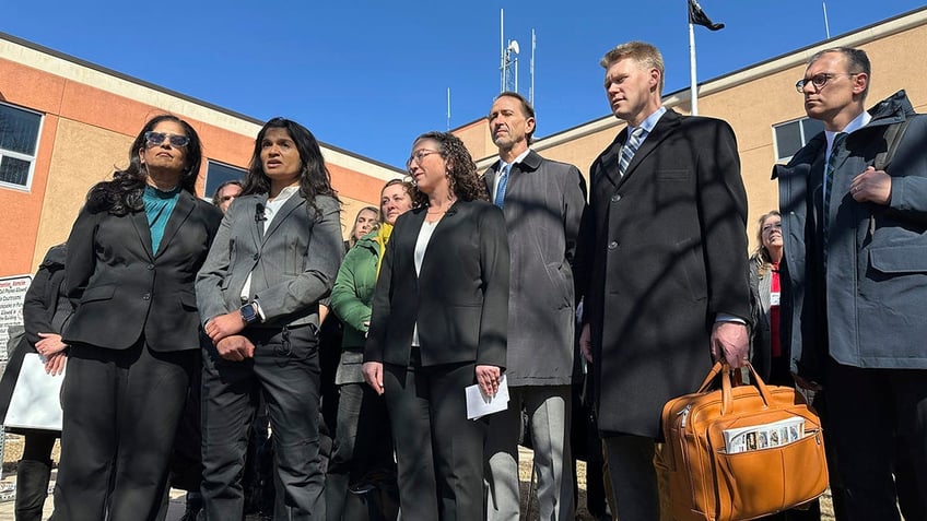 Greenpeace legal counsel outside a courthouse