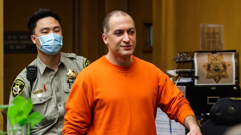 Nima Momeni, the man charged in the fatal stabbing of Cash App founder Bob Lee, is seen walking.