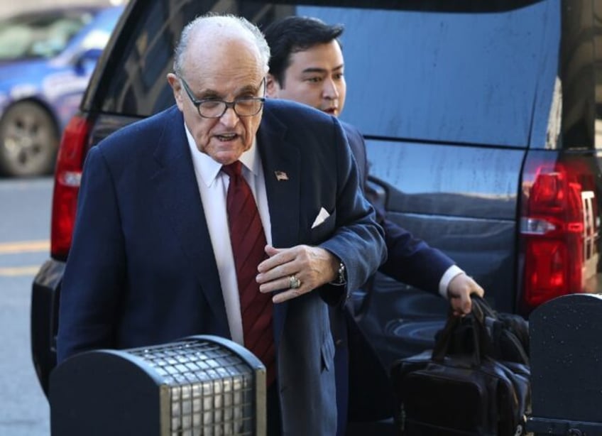 Rudy Giuliani arrives in court for a trial to determine how much the former New York mayor has to pay in damages to two Georgia election workers