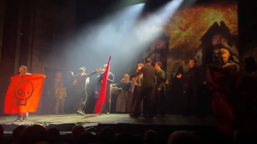 just stop oil protesters interrupt les mis performance in london called stupid people by angry crowd