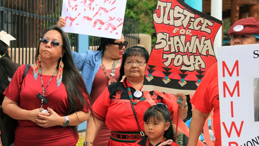 Geraldine Toya marches to bring awareness to the death of her daughter Shawna Toya