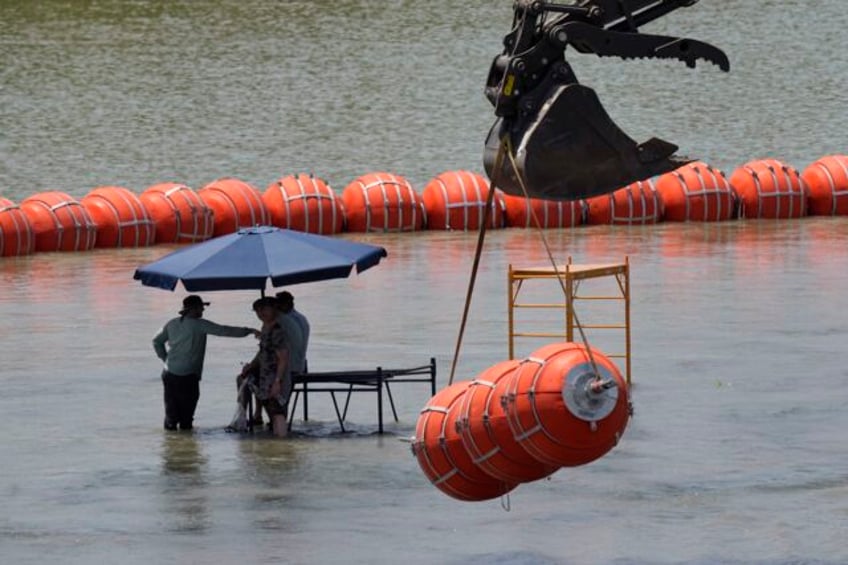 justice department tells texas that floating barrier on rio grande raises humanitarian concerns