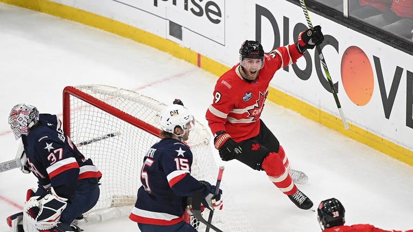 Team Canada forward Sam Bennett (9) celebrates scoring against Team USA goaltender Connor Hellebuyck (37) during the second period during the 4 Nations Face-Off ice hockey championship game at TD Garden.