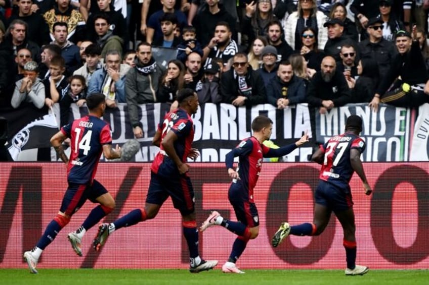 Razvan Marin (2R) celebrates his penalty which earned Cagliari a 1-1 draw at Juventus