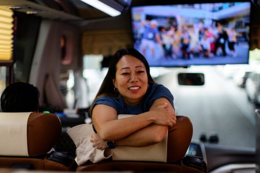 Therapist Jeanie Chang smiles as members of her K-drama tour speak about their experiences