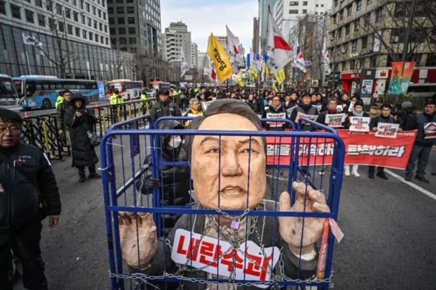 Demonstrators from a labour group take part in a protest calling for the ouster of South K